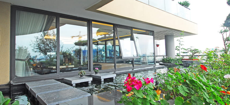Thiết Kế Nhà Kính Cường Lực Kết Hợp Hệ Thống Cây Xanh 